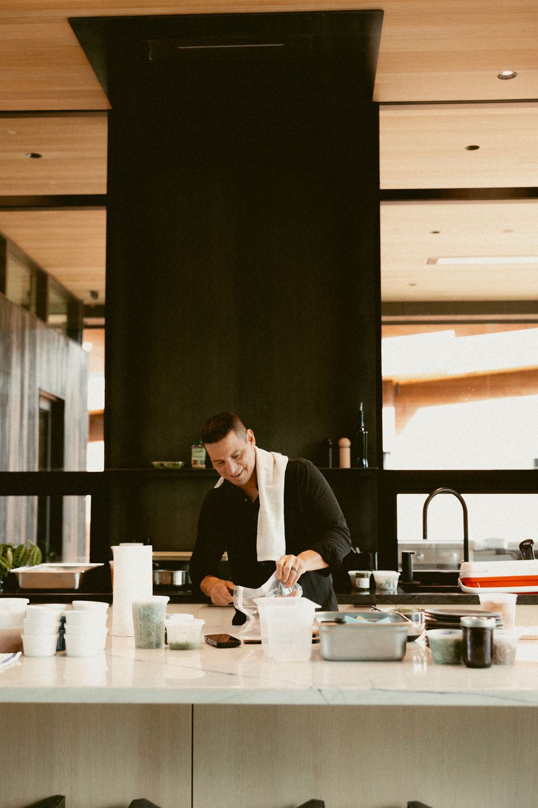 Caleb cooking in a large private kitchen